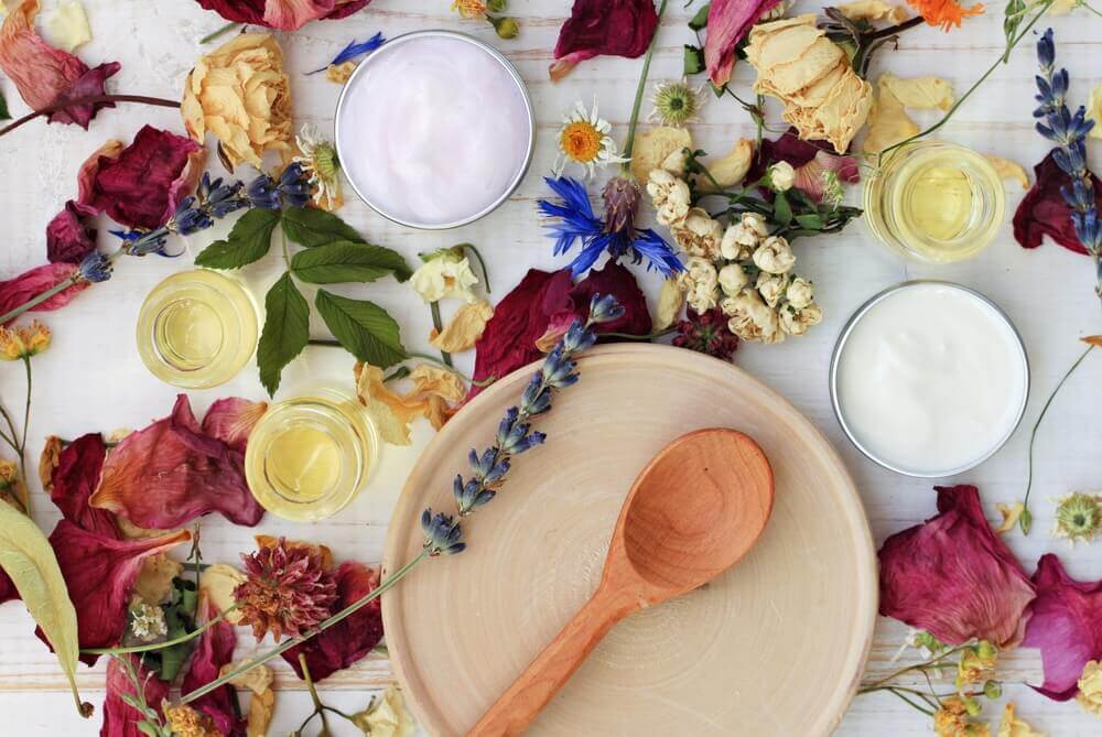 Dried flowers and herbs around skin care products